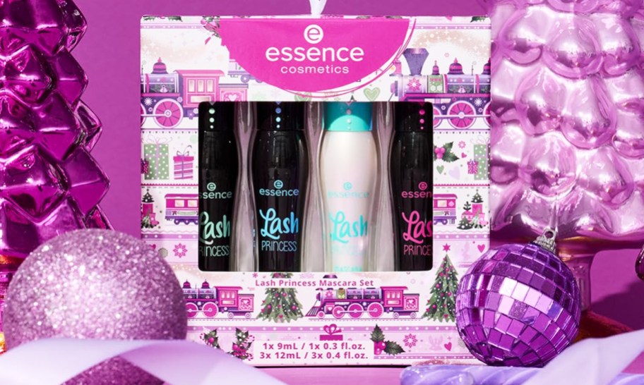 essence mascara gift set near pink ornaments and trees