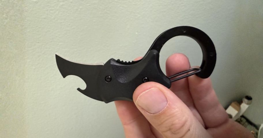 folding knife keychain in hand