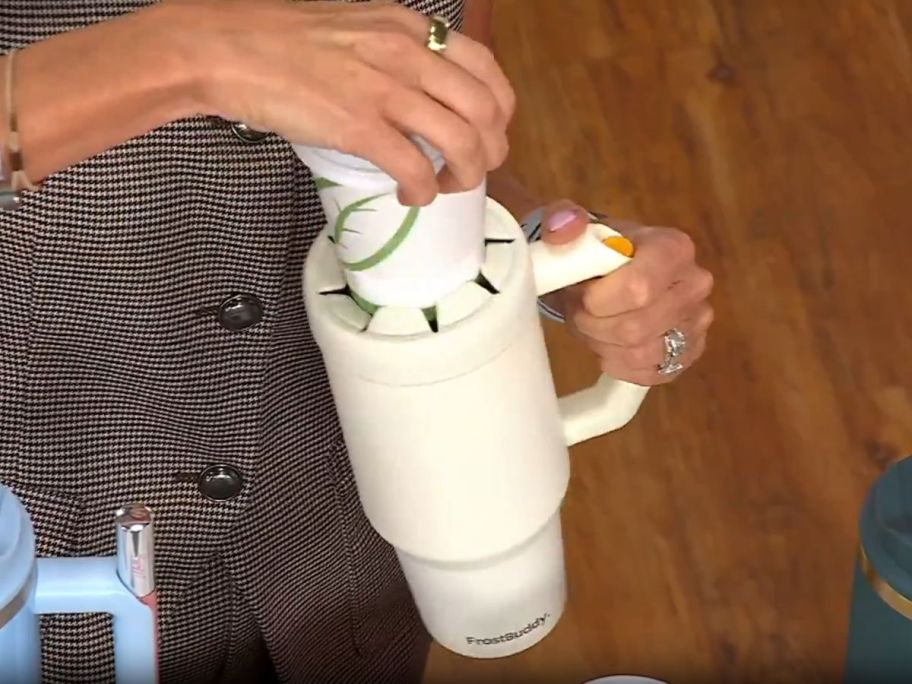 woman putting to go coffee cup in Frost Buddy 40-oz Thicc Buddy