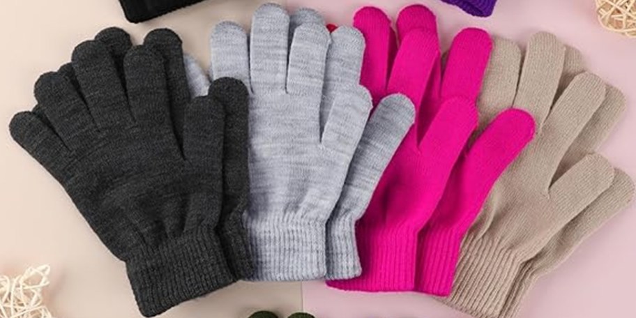 black, gray, pink, and tan gloves