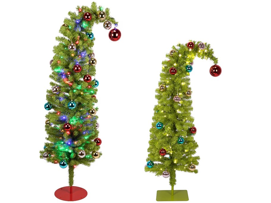 two grinch trees with ornaments 