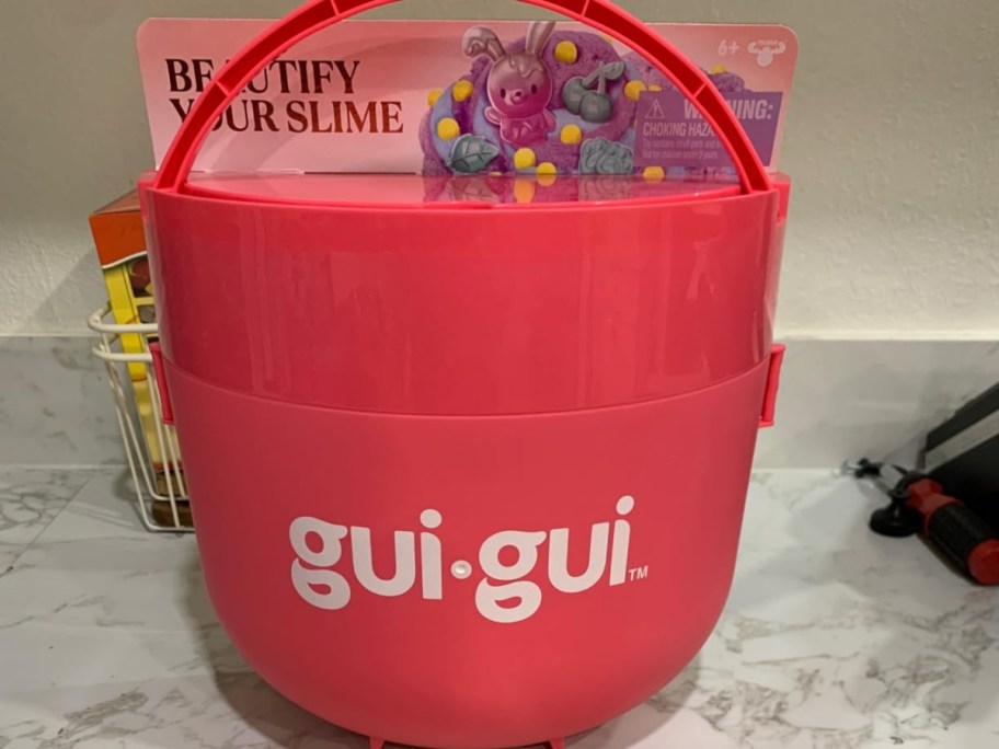 pink bucket full of slime