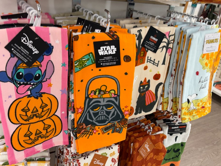stitch, star wars, and snoopy kitchen towels hanging in store 