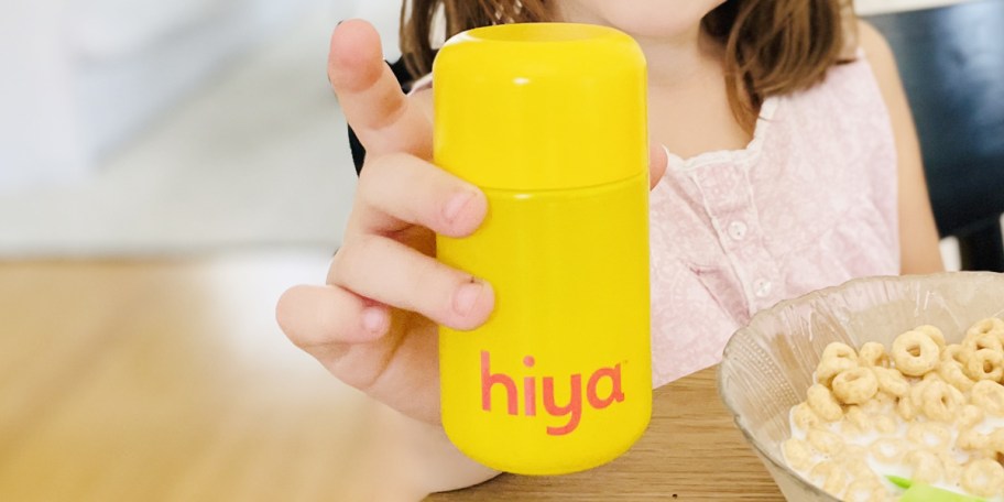 hand holding hiya vitamins bottle 