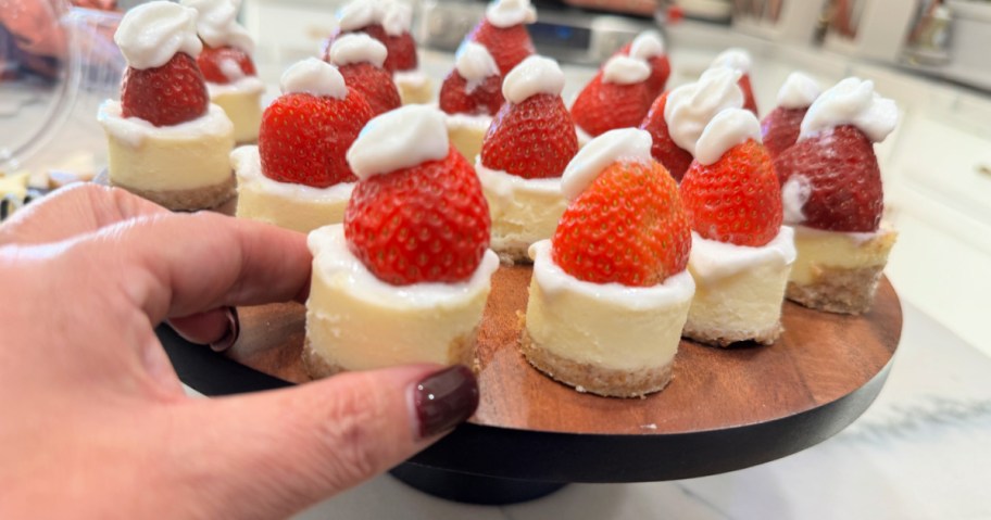 holding a santa hat cheesecake bite 