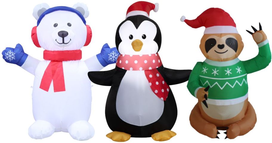 three holiday time christmas inflatables
