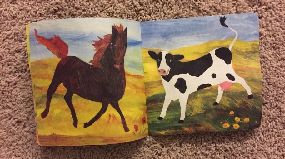 horse and cow on book laying on carpet