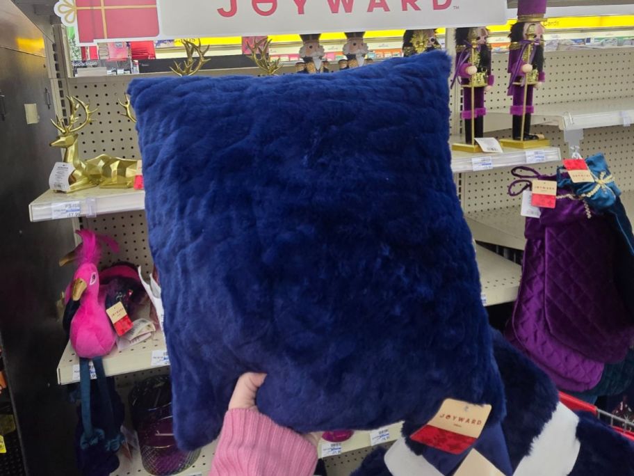 Joyward Embossed Pillow in hand in store