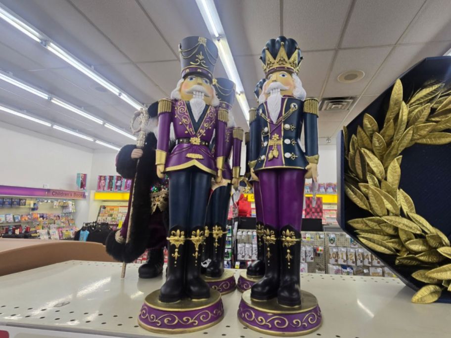 purple and blue nutcrackers on shelf in store