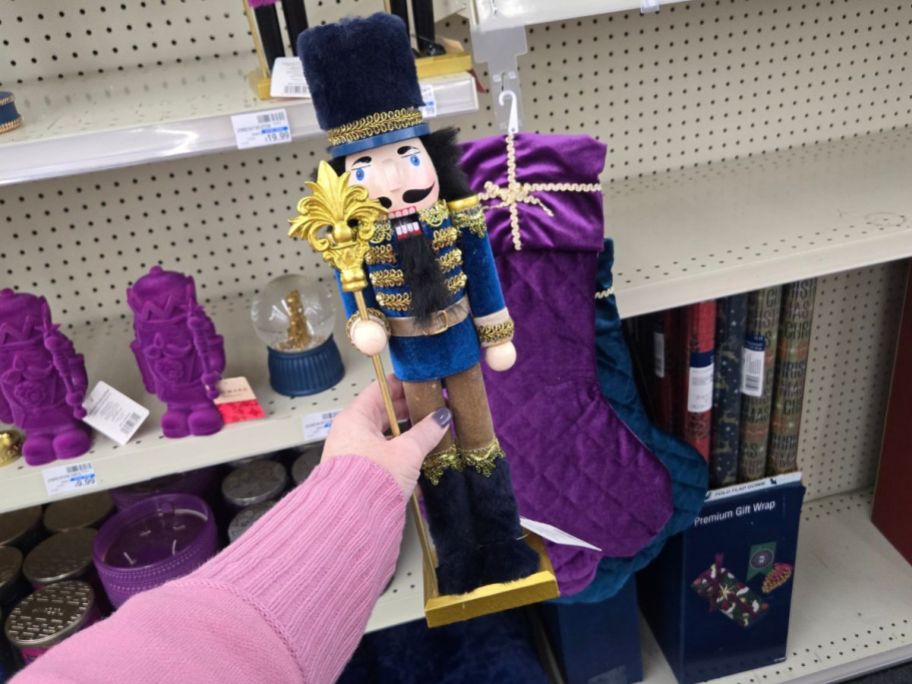 Joyward 15" Navy & Gold Nutcracker in hand in store