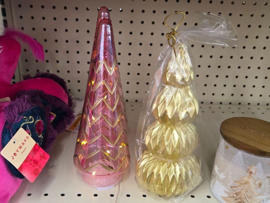 pink and gold tree decor on shelf in store