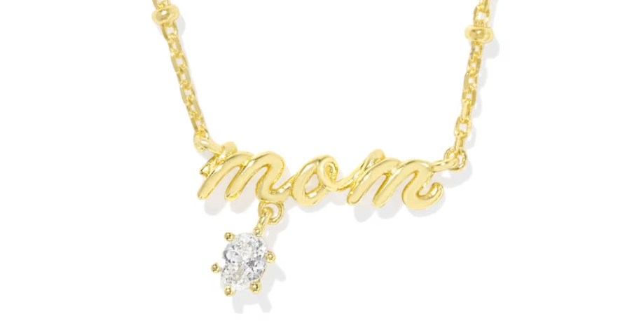 stock photo of gold mom necklace on white background