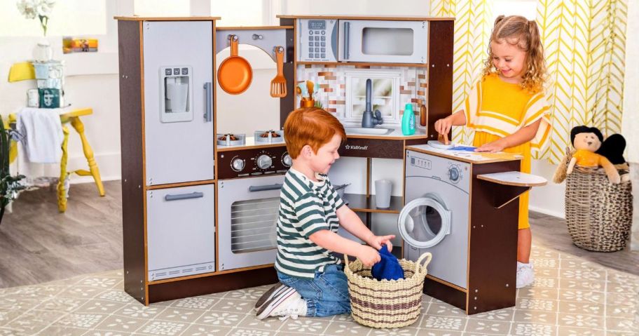 kids playing with kidkraft kitchen in playroom