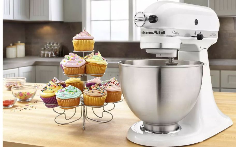 kitchenaid mixer with cupcakes on the table