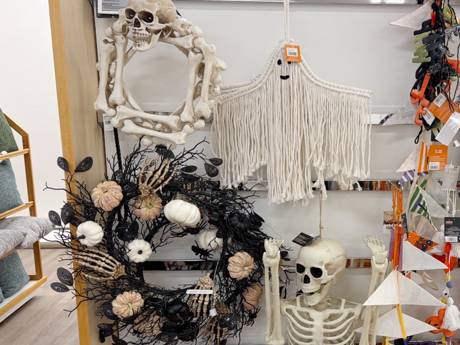 skeleton and floral wreath and a ghost hanging decor 