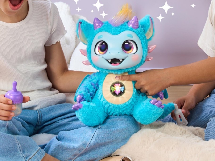 holding a blue plush dragon