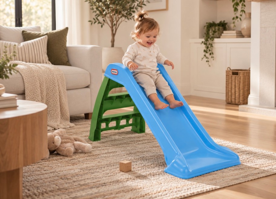 baby going down little tikes slide