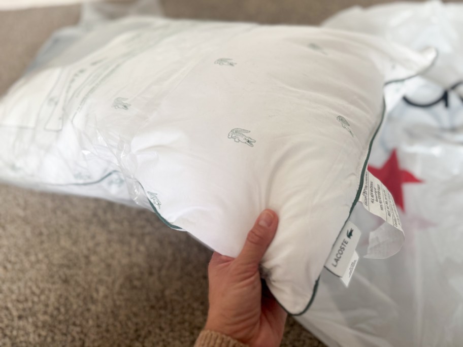 hand grabbing white pillow