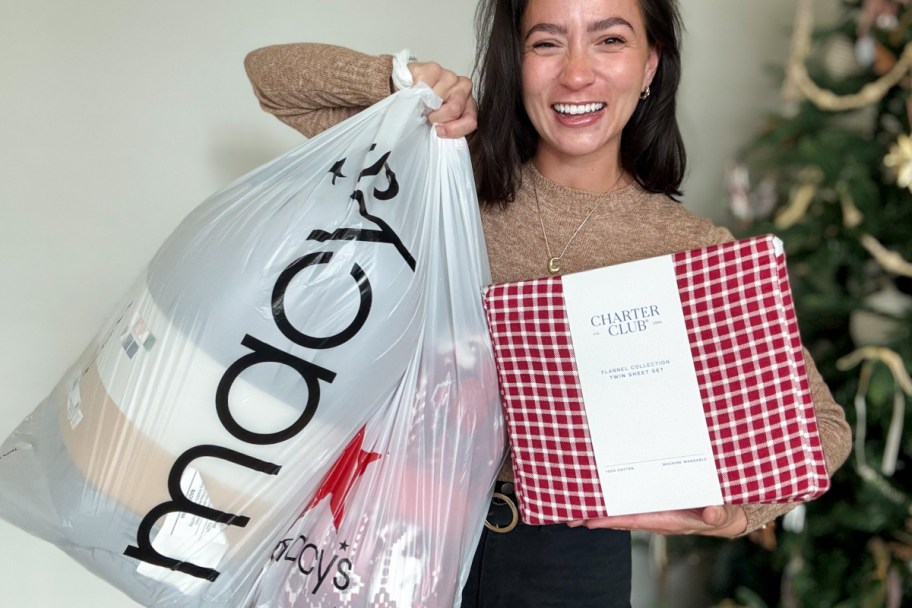woman holding macys bag and red checkered sheets
