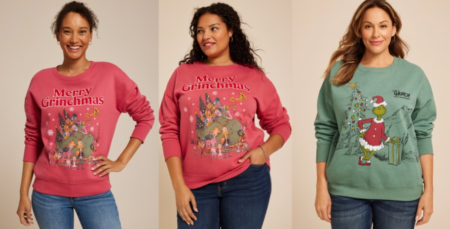 Three women wearing Grinch holiday tshirts.