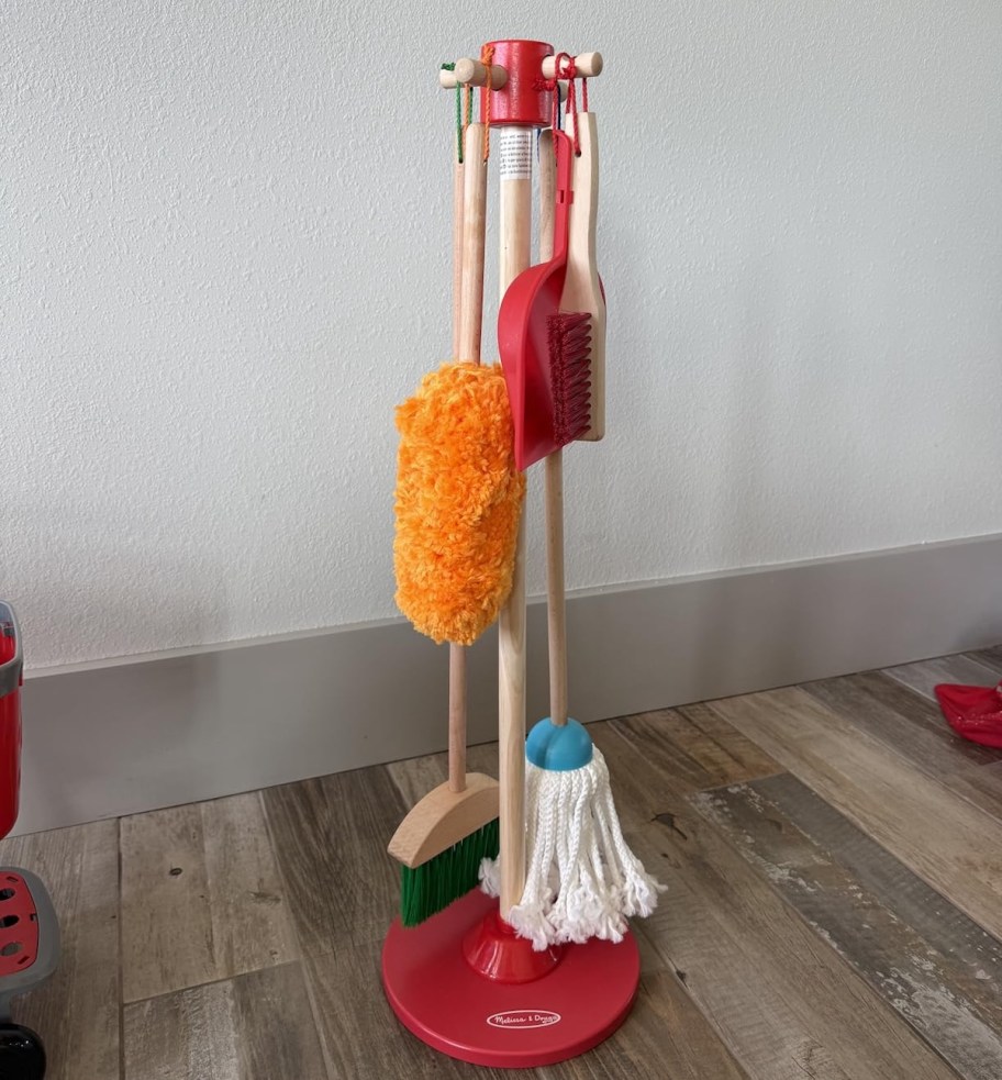 kids toy cleaning set on wood floor