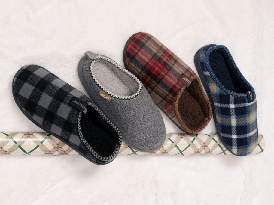 Four pairs of mens MUK LUKS slippers.