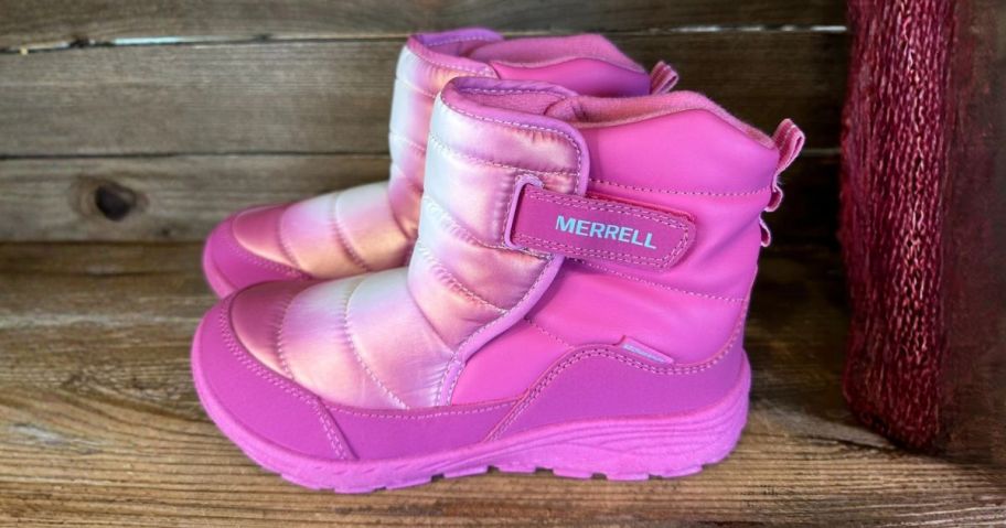 pink merrell boots on shelf