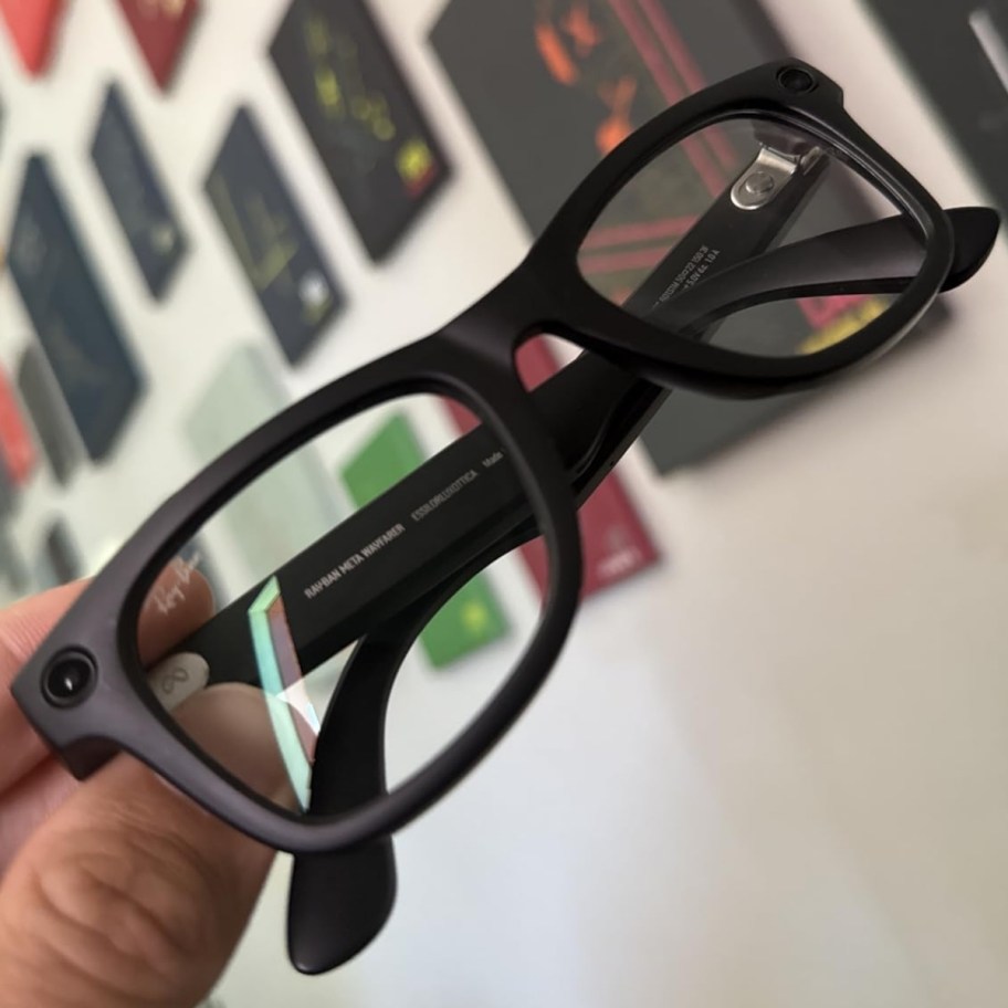 hand holding a pair of meta smart glasses