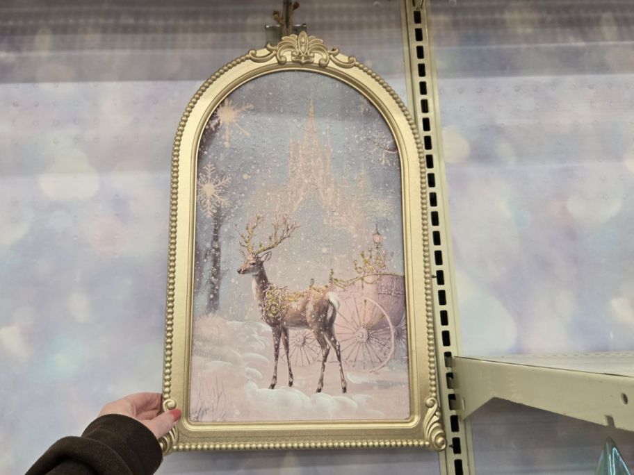 Snowy Reindeer & Cart Wall Décor in hand in store