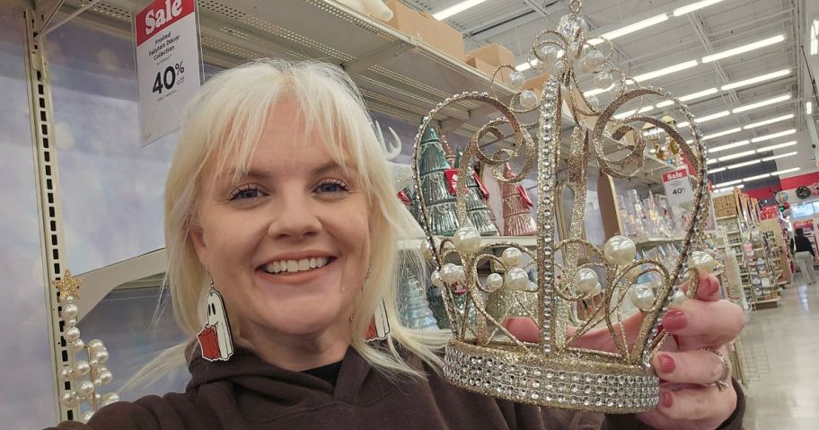 woman holding crown in store