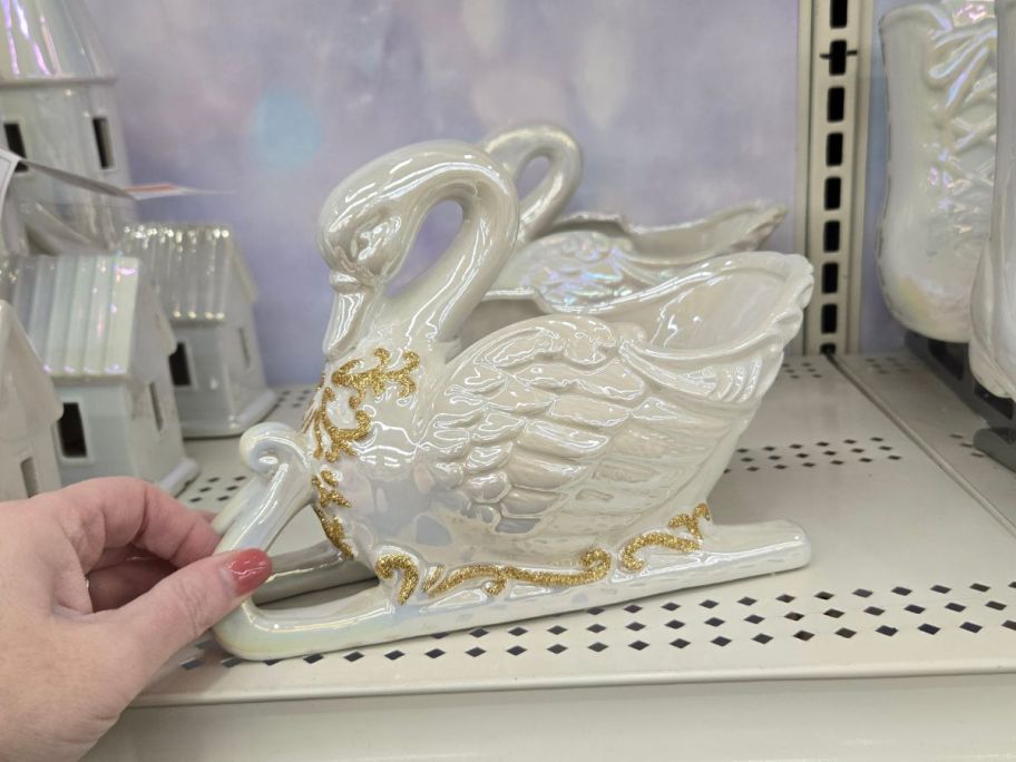 Ceramic Swan Sled Tabletop Décor on shelf in store