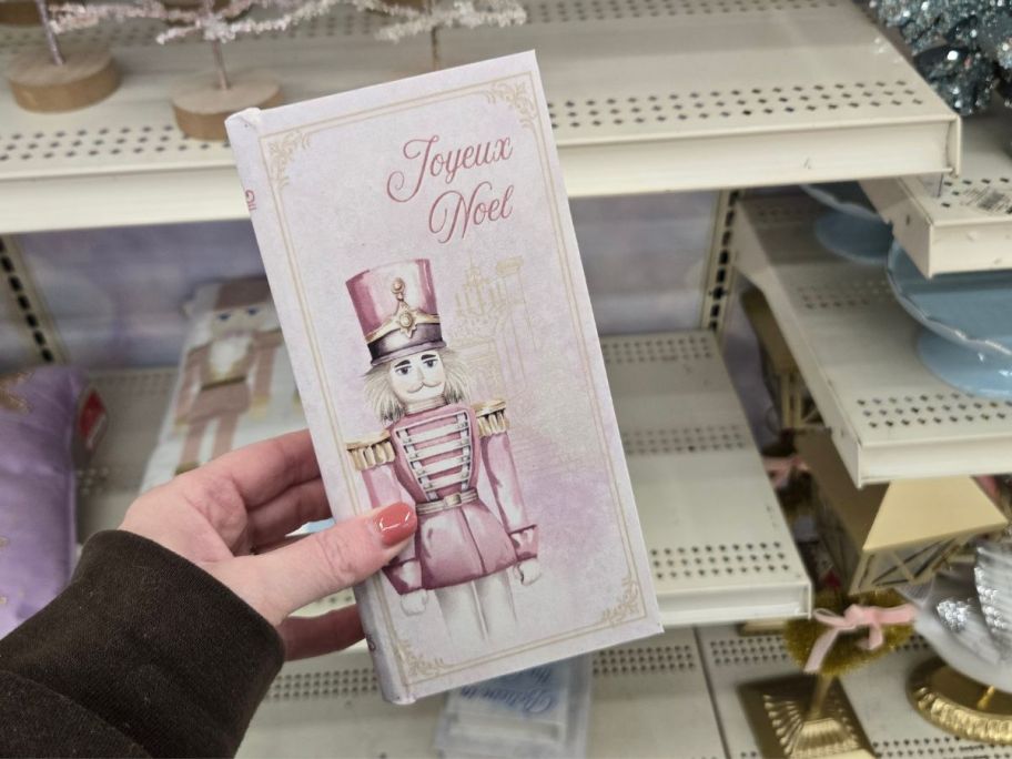 Joyeux Noel Nutcracker Tabletop Book Box in hand in store