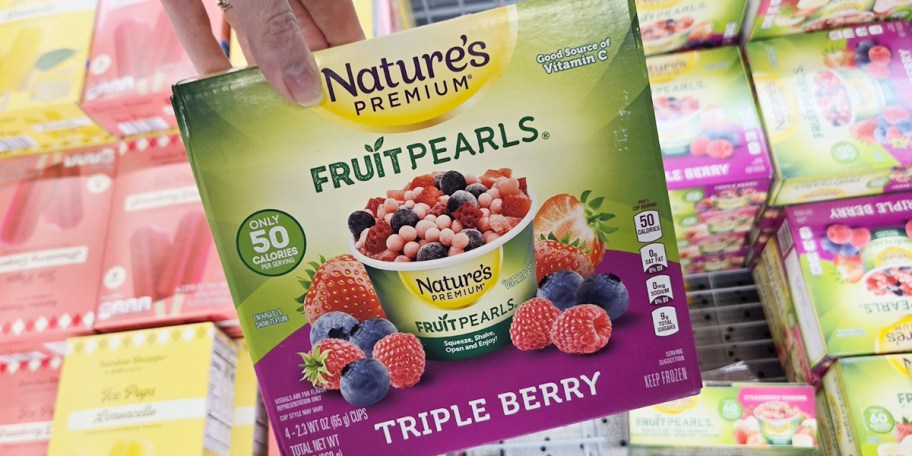 hand holding box of fruitpearls 