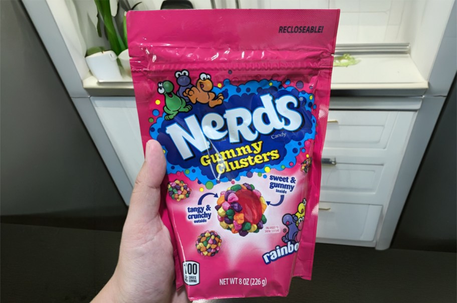person holding nerds gummy clusters