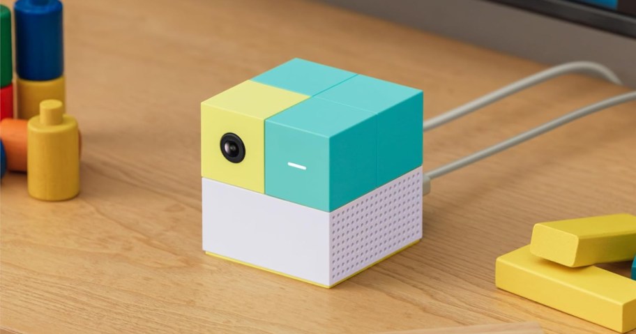 nex playground set on a table surrounded by colorful blocks