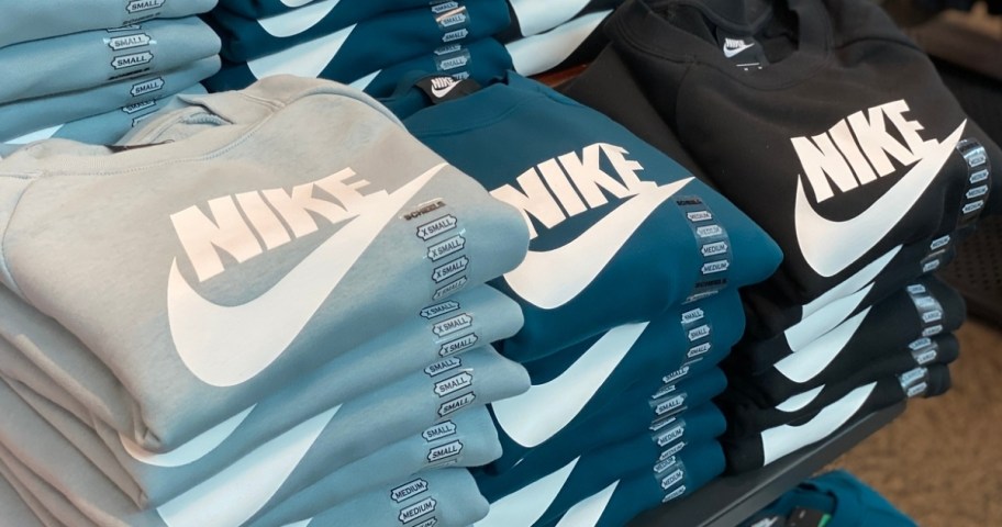 gray, blue and black nike sweatshirts