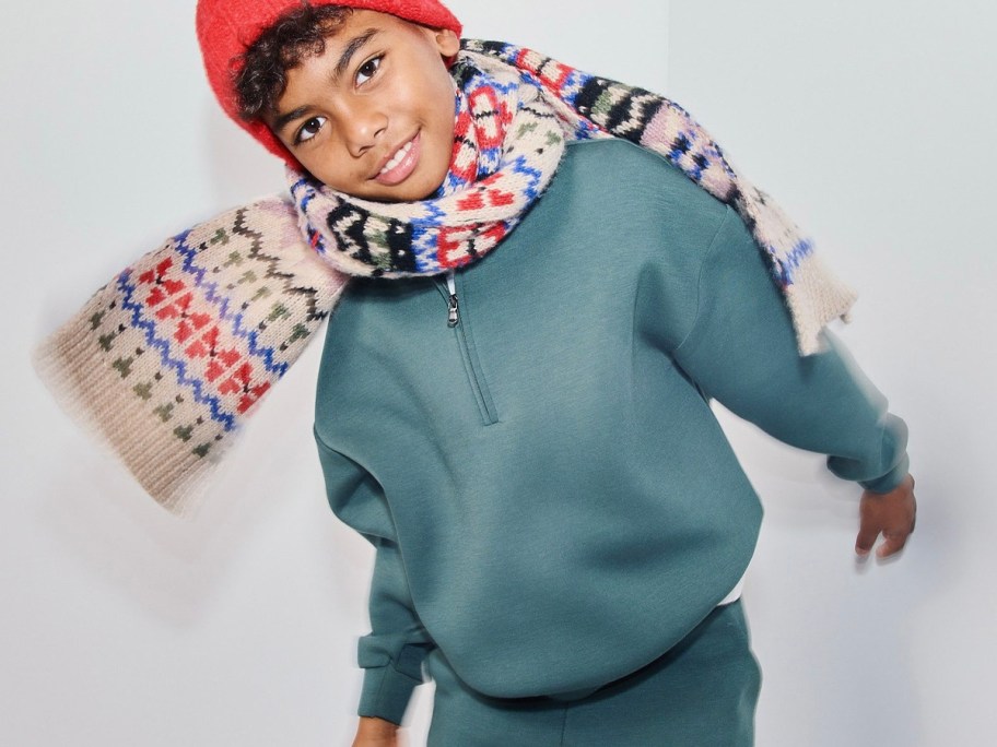 boy wearing green fleece jacket with scarf