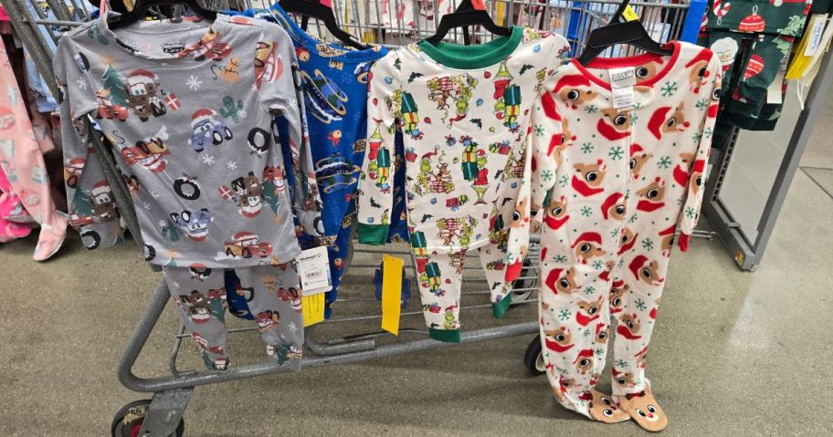 toddler character pajamas hanging on cart in store