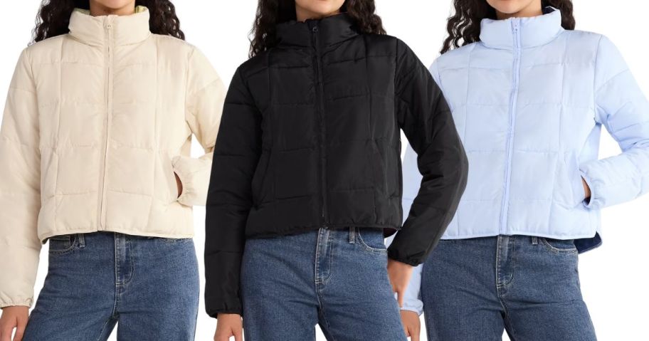 three women wearing no boundaries puffer jackets