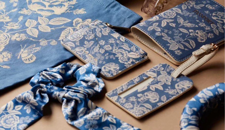 english rose patterned accessories, including tote bag, luggage tag, passport case and scrunchie
