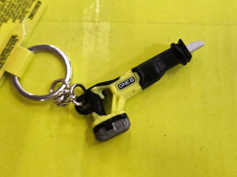 RYOBI Mini Reciprocating Saw Keychain on box in store