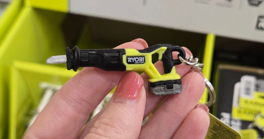 RYOBI Mini Reciprocating Saw Keychain in hand in store
