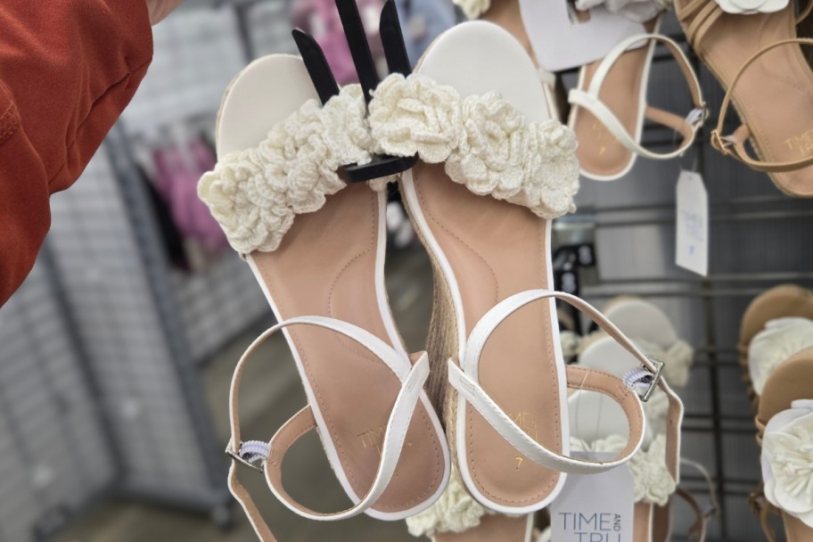 a pair of white wedge sandals
