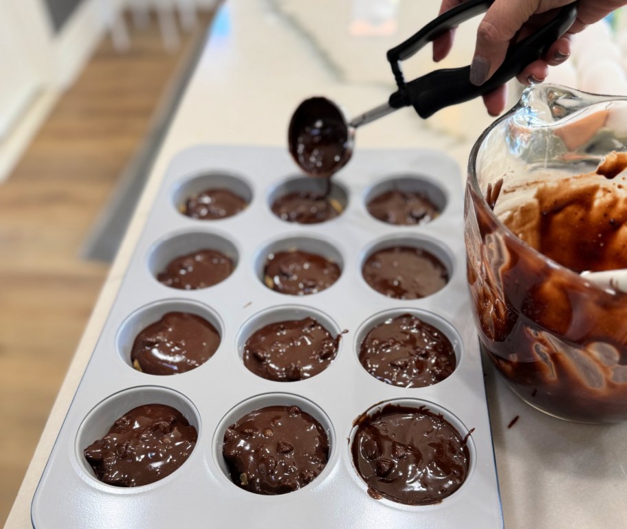 scooping brownie batter into muffin pan (1)