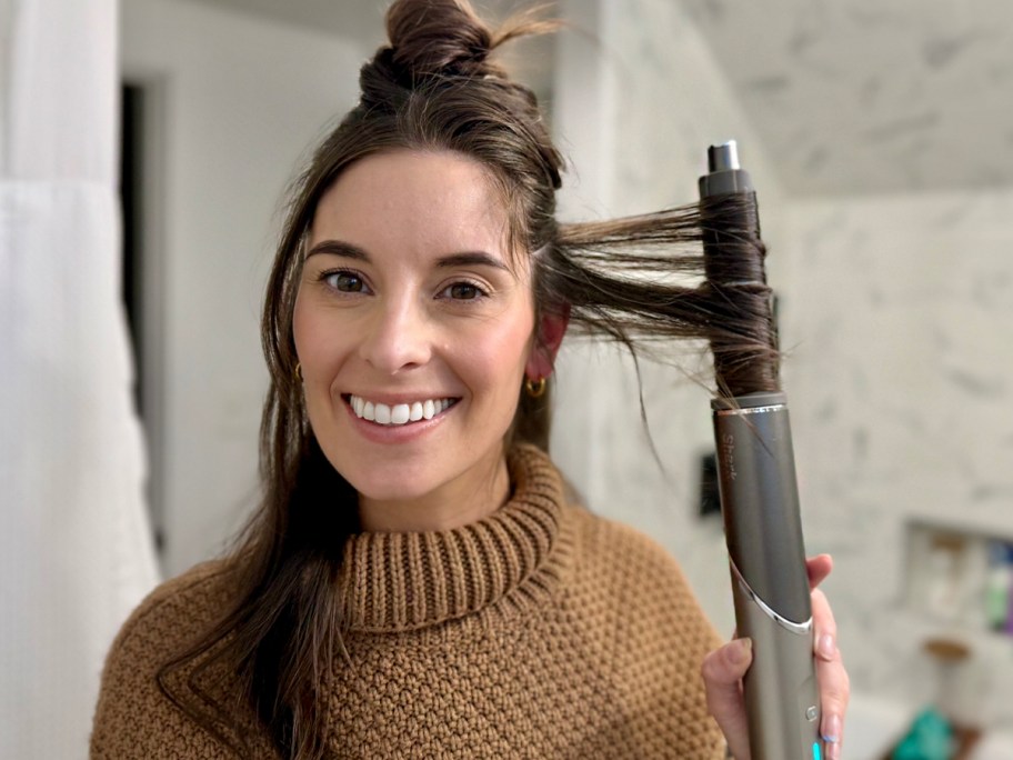 woman curling her hair with shark styler