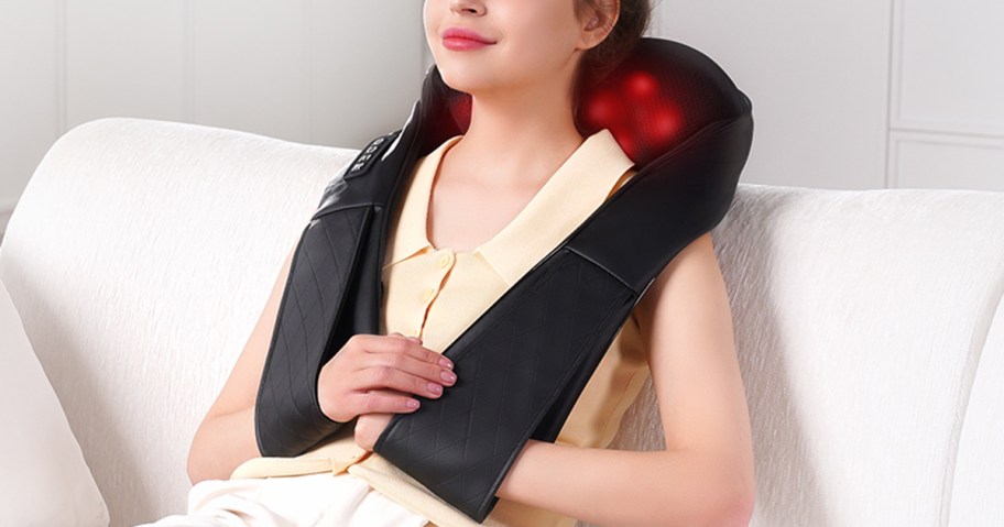 woman wearing a neck massager