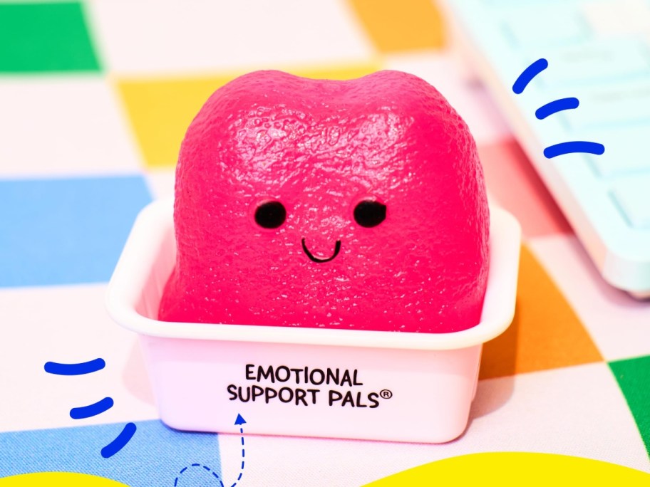 pink squishy nugget in white sauce cup