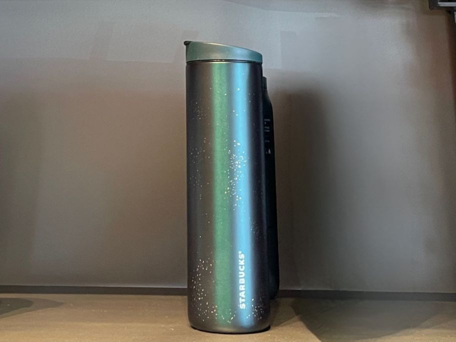 green and Gold Speckled Tumbler on shelf in store