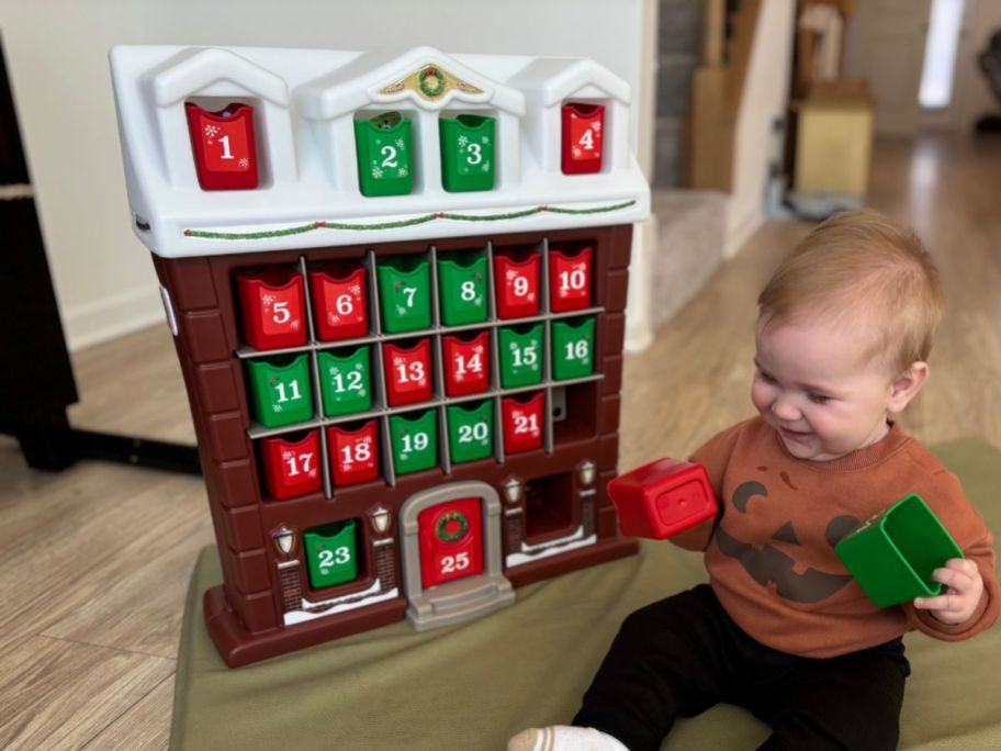 baby playing with Step2 My First Advent Calendar