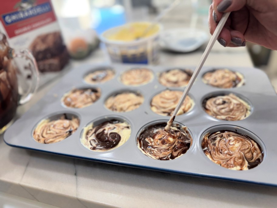 swirling the cream cheese and brownie 